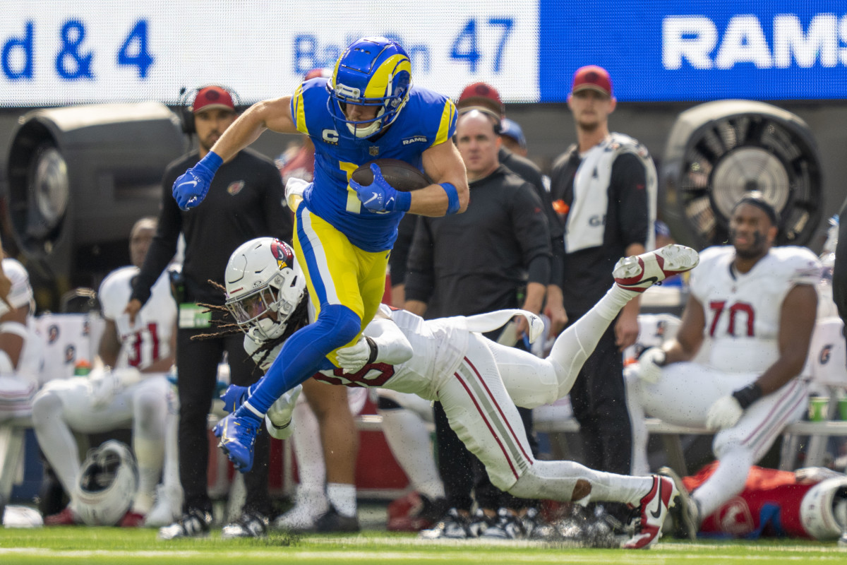 October 15, 2023; Inglewood, California, USA; Los Angeles Rams wide receiver Cooper Kupp (10) runs the football against Arizona Cardinals safety Andre Chachere (36) during the first quarter at SoFi Stadium.  